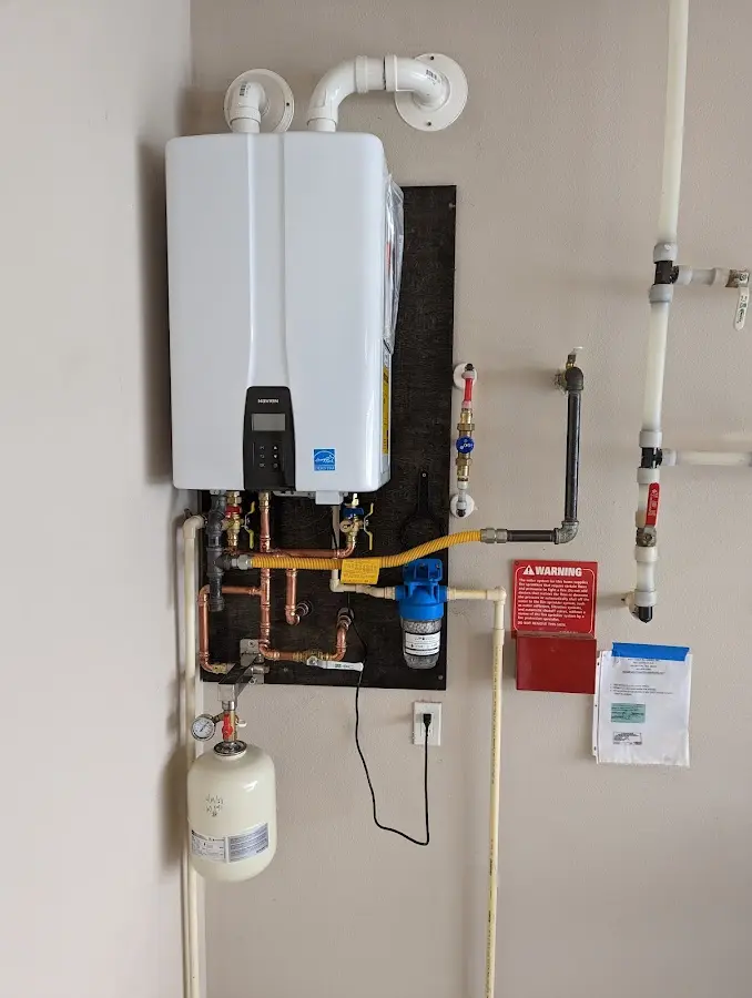 Professional plumber installing copper piping in a Crystal City home